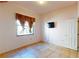 Bedroom with tile floors and window at 235 Foggy Creek Rd, Davenport, FL 33837