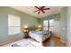 Spacious bedroom with two windows, ceiling fan, and tiled floors at 235 Foggy Creek Rd, Davenport, FL 33837