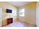 Bedroom with tile floors and large window at 235 Foggy Creek Rd, Davenport, FL 33837