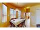 Dining area with wood table and corner windows at 235 Foggy Creek Rd, Davenport, FL 33837