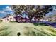 One-story house with a spacious lawn and mature trees at 235 Foggy Creek Rd, Davenport, FL 33837