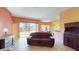 Living room with sliding doors leading to the backyard at 235 Foggy Creek Rd, Davenport, FL 33837