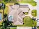 Aerial shot of a large single Gathering home with a circular driveway and pool at 324 Hamilton Shores Ne Dr, Winter Haven, FL 33881