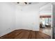 Bedroom with wood floors and doorway view to a cozy sitting room at 324 Hamilton Shores Ne Dr, Winter Haven, FL 33881