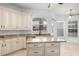 Spacious kitchen island with granite countertops and sink at 324 Hamilton Shores Ne Dr, Winter Haven, FL 33881