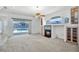 Spacious living room featuring a fireplace and sliding glass doors to the pool area at 324 Hamilton Shores Ne Dr, Winter Haven, FL 33881