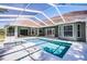 Backyard pool with a screen enclosure, surrounded by the home's exterior at 324 Hamilton Shores Ne Dr, Winter Haven, FL 33881