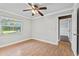 Cozy bedroom featuring a window with natural light and wood-look flooring at 4570 Chambliss Rd, Winter Haven, FL 33884