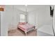 Bright bedroom with a bed, hanging chair, and TV at 935 Waterville Dr, Auburndale, FL 33823