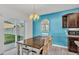 Dining room with wooden table and chairs, view of backyard at 935 Waterville Dr, Auburndale, FL 33823