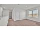 Upstairs hallway with carpet and doors at 935 Waterville Dr, Auburndale, FL 33823