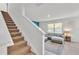 Stairs leading to the second floor, view of living room at 935 Waterville Dr, Auburndale, FL 33823