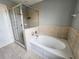 Bathroom with shower, tub, and double vanity at 2556 Ladoga Dr, Lakeland, FL 33805
