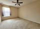 Bright bedroom with window and ceiling fan at 2556 Ladoga Dr, Lakeland, FL 33805