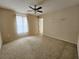 Simple bedroom with ceiling fan and window at 2556 Ladoga Dr, Lakeland, FL 33805