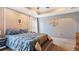 Main bedroom with plush bed, neutral walls and carpet flooring at 2556 Ladoga Dr, Lakeland, FL 33805