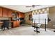 Home gym with weight bench, barbell, and exercise bike at 2556 Ladoga Dr, Lakeland, FL 33805