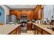 Spacious kitchen with wood cabinets, stainless steel appliances, and an island at 2556 Ladoga Dr, Lakeland, FL 33805