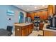 Bright kitchen with wood cabinets, stainless steel appliances & breakfast bar at 2556 Ladoga Dr, Lakeland, FL 33805