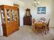 Charming dining room with a chandelier, a hutch, and a classic dining table at 2712 Oak Hammock Loop, Mulberry, FL 33860