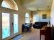 Inviting living room with warm natural light, comfortable seating, and an open concept design at 2712 Oak Hammock Loop, Mulberry, FL 33860