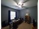 Comfortable home office with a ceiling fan, desk, and storage for an efficient workspace at 2712 Oak Hammock Loop, Mulberry, FL 33860
