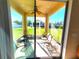 Relaxing screened-in porch with comfortable seating, perfect for enjoying the outdoors bug-free at 2712 Oak Hammock Loop, Mulberry, FL 33860