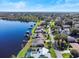 Beautiful aerial view of waterfront homes on a lake, each featuring pools and private docks at 288 Hernando Rd, Winter Haven, FL 33884