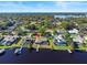 Aerial view of lakefront property highlighting pool and dock, with a map marker indicating location at 288 Hernando Rd, Winter Haven, FL 33884