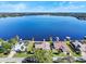 Aerial view of lakefront homes with private docks, showcasing serene waters and neighborhood at 288 Hernando Rd, Winter Haven, FL 33884