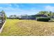 Expansive backyard with a screened-in porch, great for outdoor entertaining at 288 Hernando Rd, Winter Haven, FL 33884