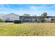 Well-maintained backyard featuring a screened-in lanai and lush landscaping at 288 Hernando Rd, Winter Haven, FL 33884