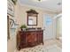 Bathroom features a decorative wood vanity with granite countertop at 288 Hernando Rd, Winter Haven, FL 33884