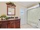 Bathroom features a decorative wood vanity with granite countertop at 288 Hernando Rd, Winter Haven, FL 33884