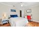 Cozy bedroom with a dedicated workspace featuring a television and study area at 288 Hernando Rd, Winter Haven, FL 33884