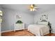 Bright bedroom featuring a ceiling fan, a dresser, and a comfortable bed at 288 Hernando Rd, Winter Haven, FL 33884