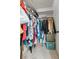 Walk-in closet with clothes neatly hanging, maximizing storage space and organization at 288 Hernando Rd, Winter Haven, FL 33884