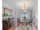 Formal dining room with hardwood floors, chandelier lighting, and stylish decor at 288 Hernando Rd, Winter Haven, FL 33884