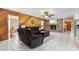 Comfortable living room with brick fireplace and wooden accent wall at 288 Hernando Rd, Winter Haven, FL 33884