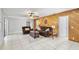 Spacious living room with wooden accent wall and comfortable furniture at 288 Hernando Rd, Winter Haven, FL 33884