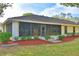 Back of house with screened patio and landscaping at 2943 Plantation Rd, Winter Haven, FL 33884