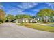 Home with circular driveway and palm trees at 2943 Plantation Rd, Winter Haven, FL 33884