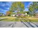 Home's exterior showcasing a lush green lawn and driveway at 2943 Plantation Rd, Winter Haven, FL 33884