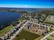 Aerial view showcasing the property's location near a lake and other homes in a peaceful community at 4027 Island Lakes Dr, Winter Haven, FL 33881