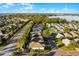 Aerial view of community, showing homes and lake at 4092 Carteret Dr, Winter Haven, FL 33884