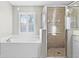 Bathroom boasts a soaking tub and a separate shower stall at 4092 Carteret Dr, Winter Haven, FL 33884