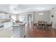 Bright, open kitchen and dining area with white cabinets and stainless steel appliances at 4092 Carteret Dr, Winter Haven, FL 33884