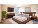 Bedroom with king-size bed and wood platform bed frame at 4364 Reding Way, Lakeland, FL 33813