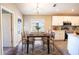 Dining area with rustic wooden table and chairs near kitchen at 4364 Reding Way, Lakeland, FL 33813