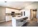 Modern kitchen with island, white cabinets, stainless steel appliances, and granite countertops at 4364 Reding Way, Lakeland, FL 33813